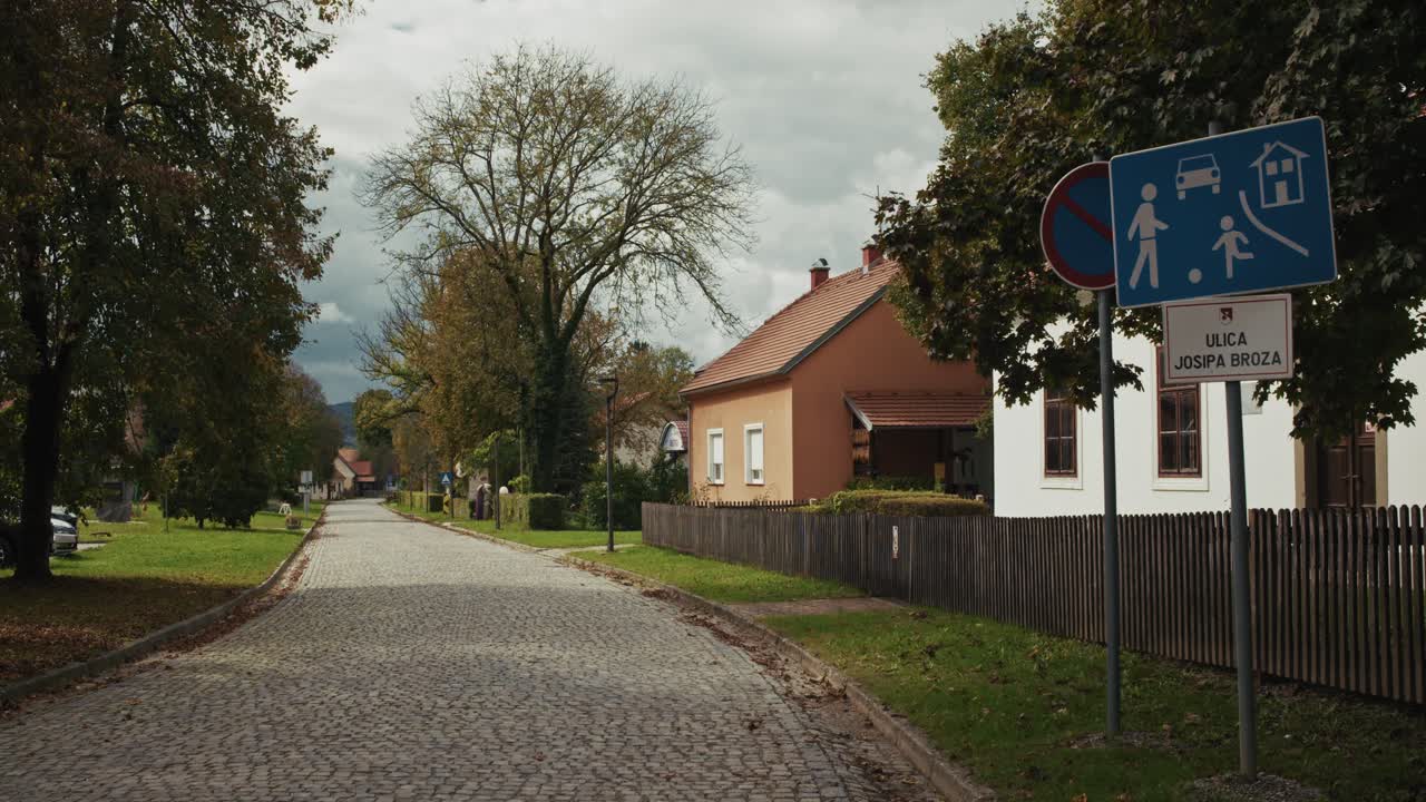 Quiet cobblestone street in Kumrovec village on Josip Broz Street, Croatia