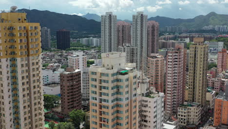 aerial fly through dense residential high rise buildings in yuen long hong kong