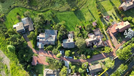 aerial rooftop view of group of houses outside bogota with trees