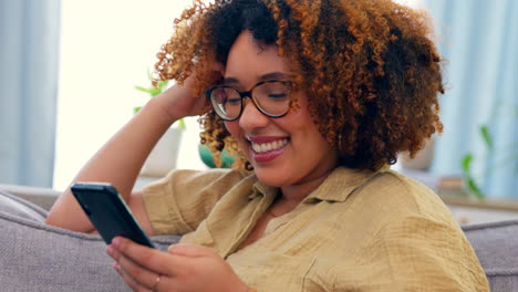 Laughing,-phone-and-black-woman-on-a-sofa