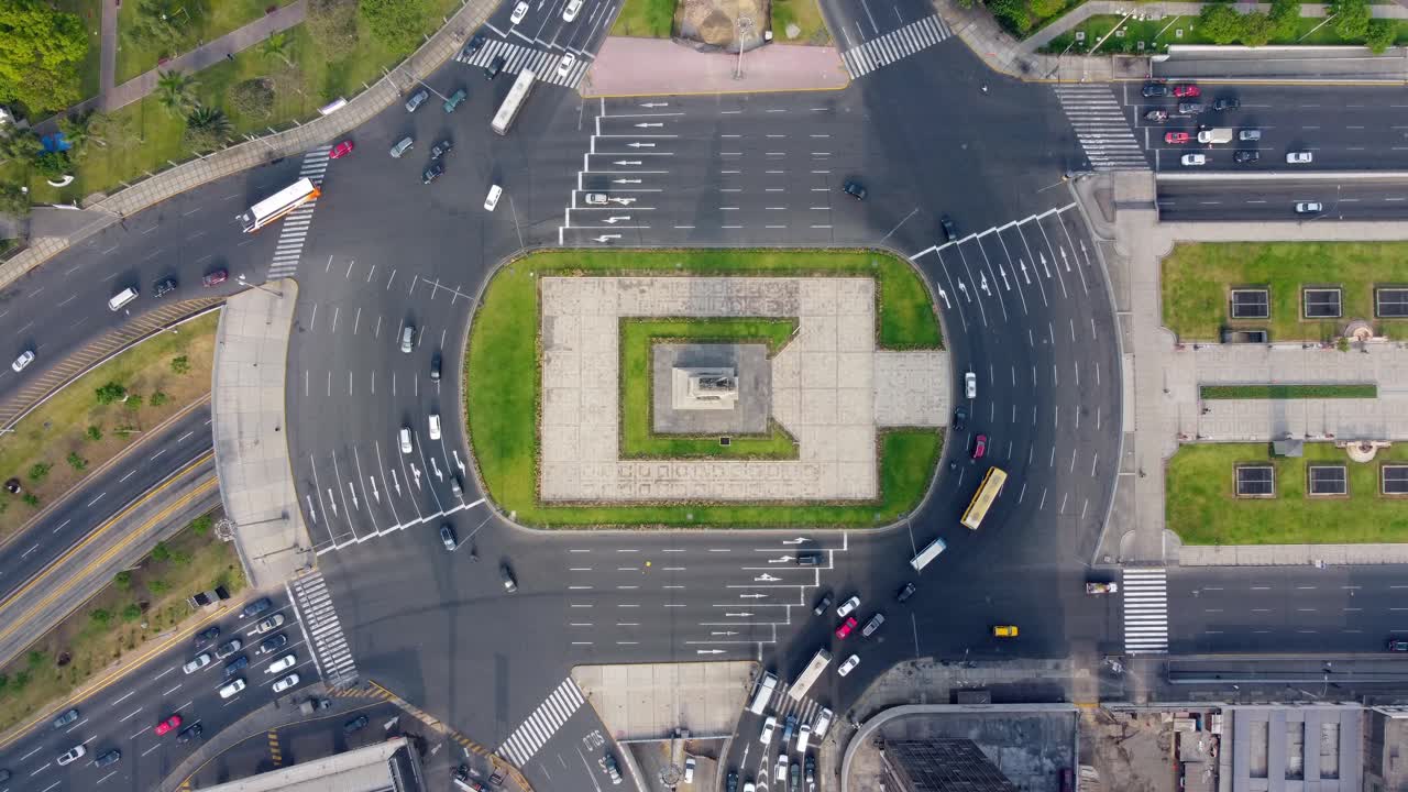 Aerial Top-Down View of Busy City Traffic Circle with Monument