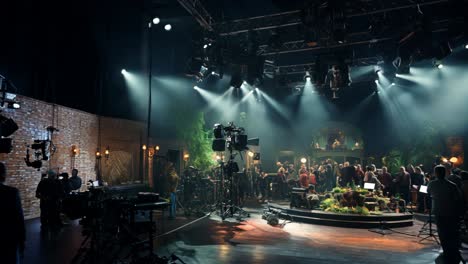 film studio set during a bustling production in the evening hours