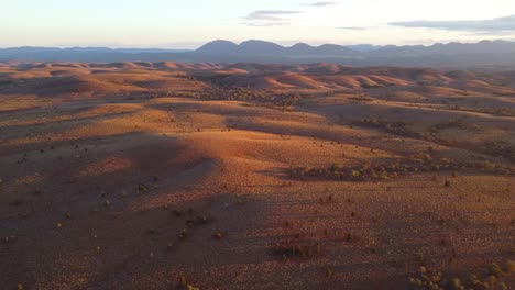 drone footage flying low over rolling hills in the flinders ranges, australia