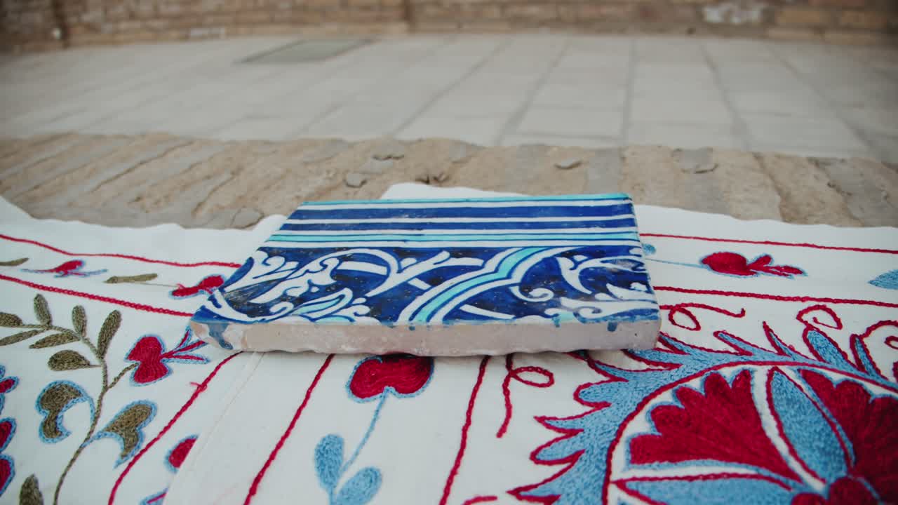Hand embroidery in Khiva Uzbekistan Fortress Ichan Kala bright clothes oriental style. Street vendors in Khiva 2