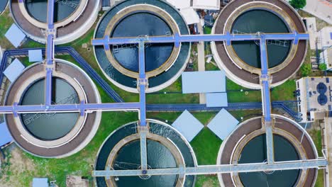 4k aerial drone top down view clarifier sedimentation tank. aerial view water treatment plant. top view of recirculation solid contact clarifier sedimentation tank