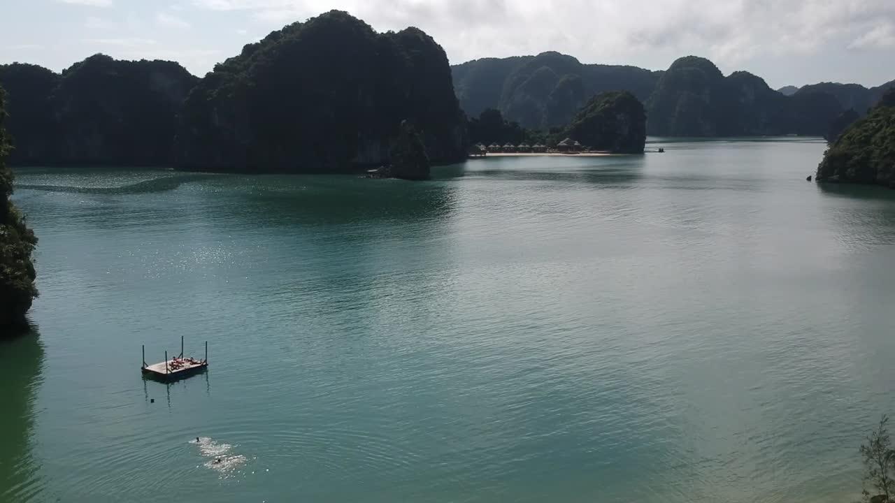 Aerial Over Beach At Freedom Island In Vietnam Out To Halong Bay. Follow Shot