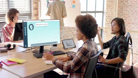 Composition-of-african-american-woman-using-computer-with-ai-chat-on-screen