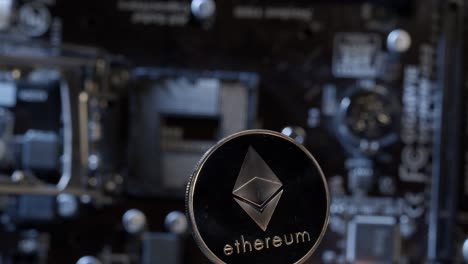 Ethereum-coin-spinning-on-digital-technology-pc-motherboard-background,-cryptocurrency-money-mining