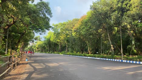 view of empty red road in the morning with blue sky above