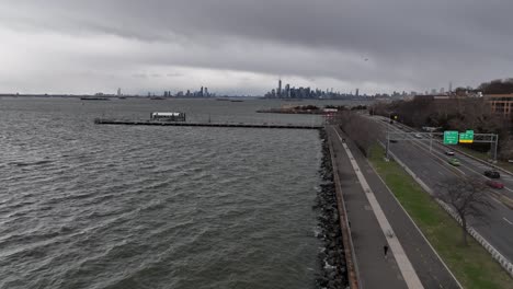 an aerial view over the paved walkway along the belt parkway by upper bay in brooklyn ny