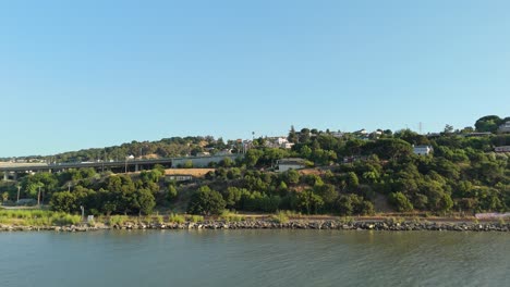 this right-to-left drone view captures crockett’s waterfront character, where coastal industry and hillside neighborhoods merge into a cinematic tableau across the strait