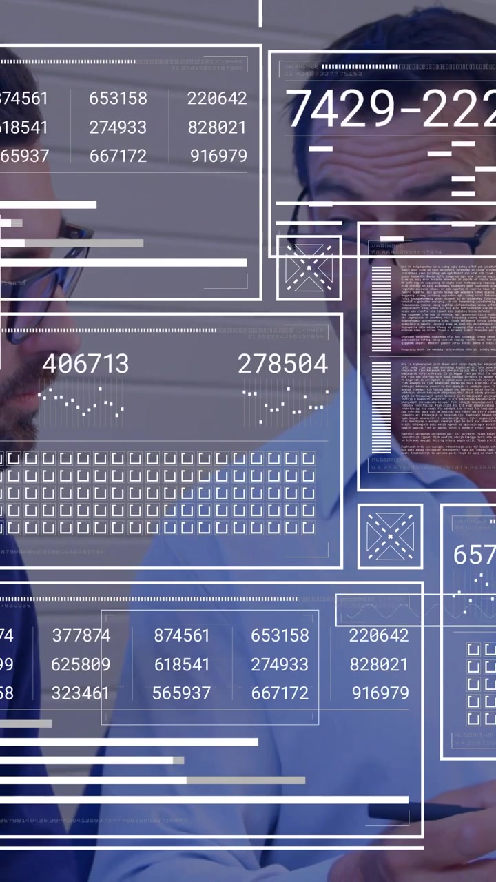 Vertical video: Two colleagues tapping stylus and reviewing tablet, HUD updating analytics charts