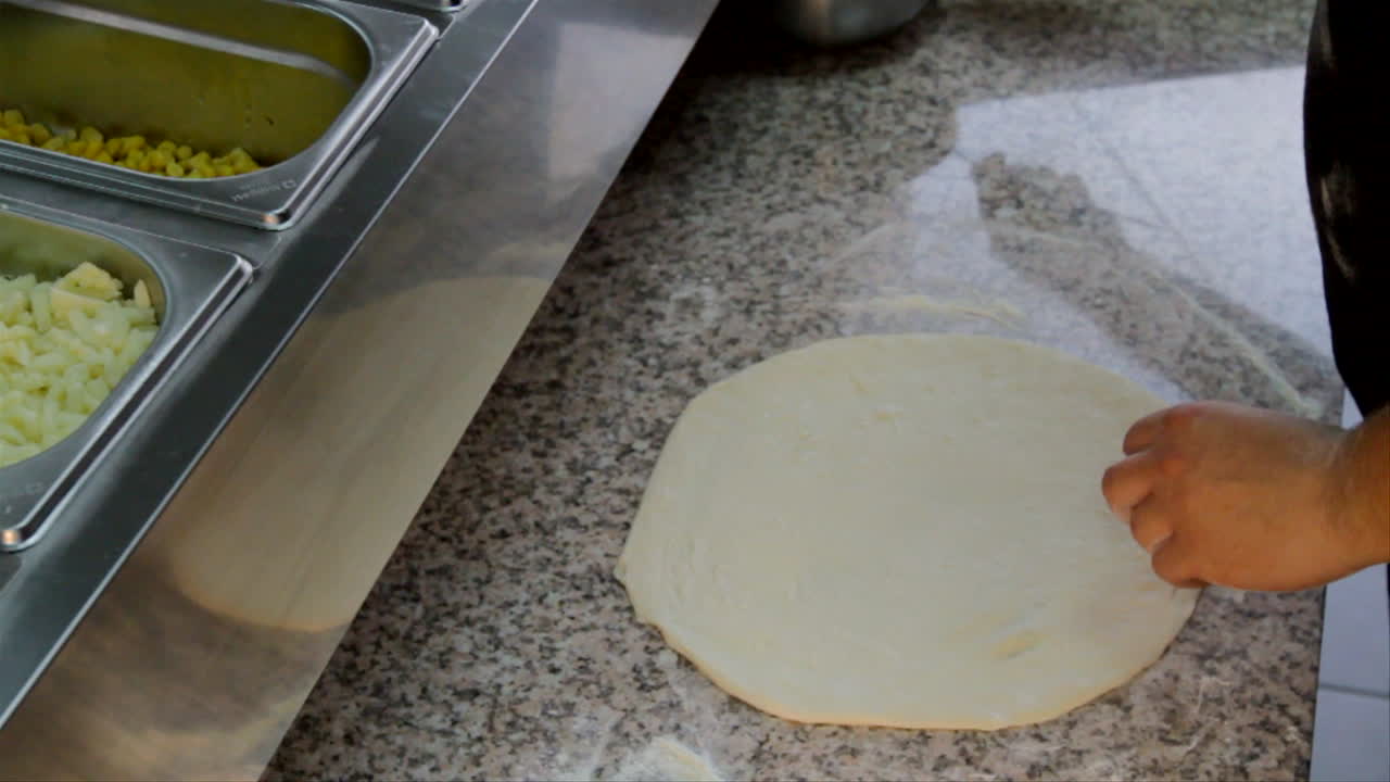 preparación para hornear pizzas