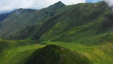 beautiful green mountain range with dramatic clouds