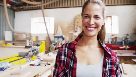 portrait of attractive carpenter smiling for camera