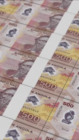 vertical video of 500 angolan kwanza banknotes printed by a money press