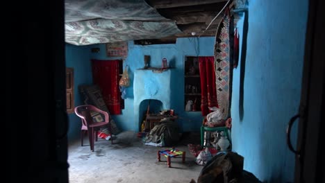 Traditional-Kashmiri-house-interior-with-vibrant-blue-walls-and-rustic-decor