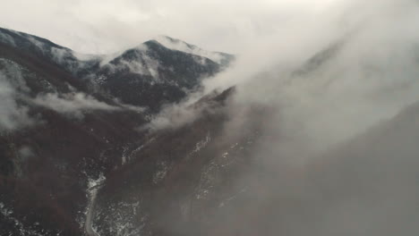 sharp peaks with clouds around them