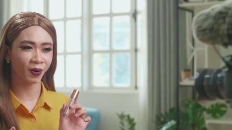 influencer young transgender woman blogger talks about makeup. blogger talks facial beauty treatments. vlogger broadcasts how to use of cosmetic in home studio