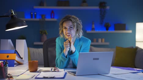 home office worker woman looking nervously at camera.