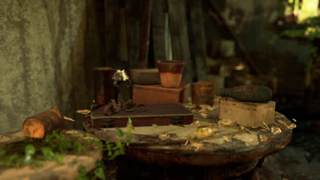 old table with rusty objects, vintage candle holder, and books