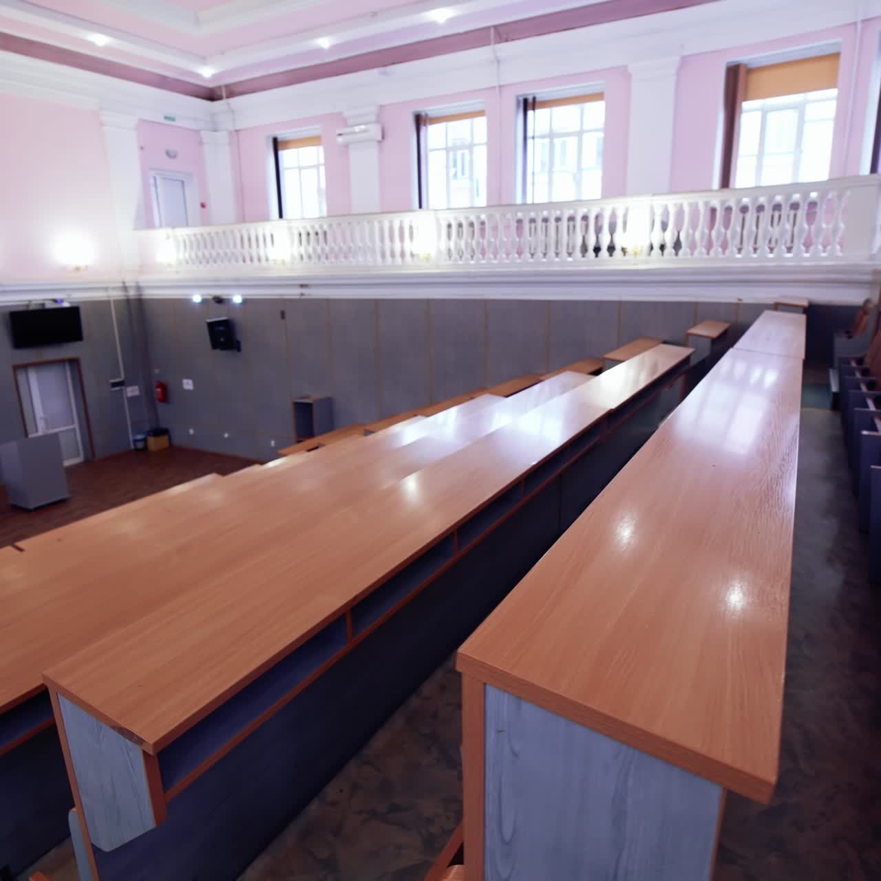 Inside university lecture hall with nobody inside. Interior of big auditorium