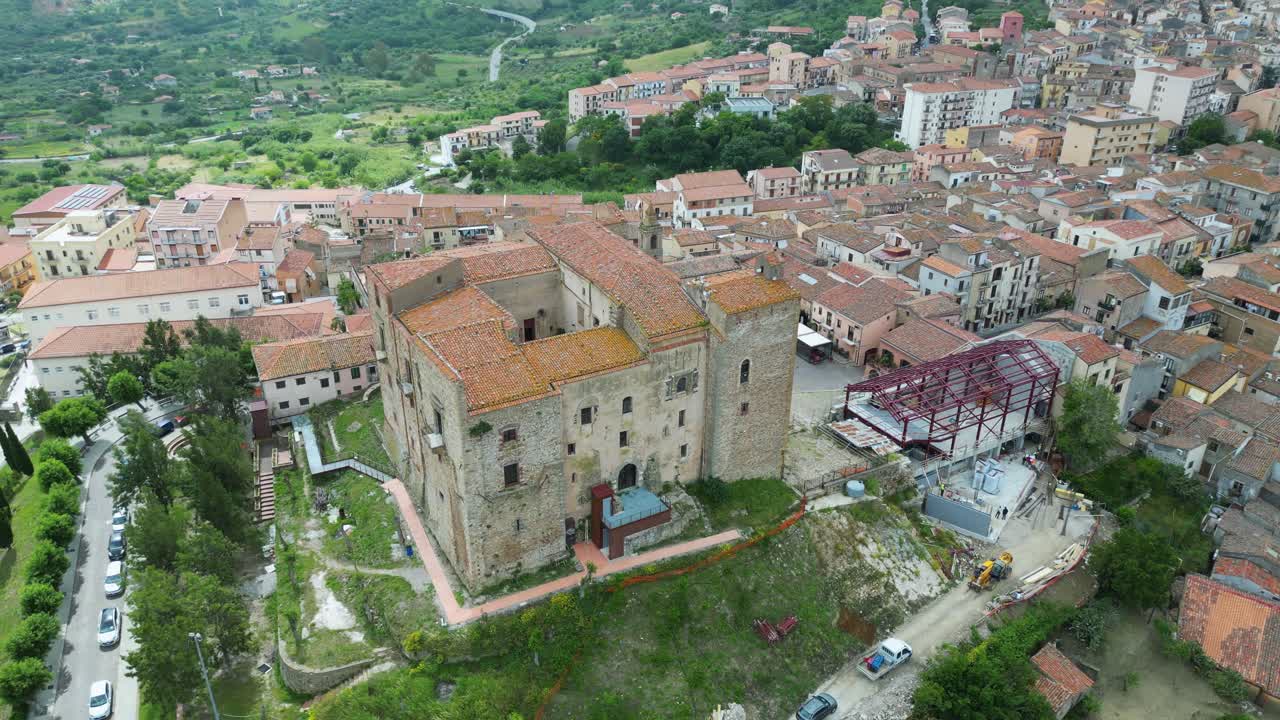 Aerial drone footage of Castelbuono, Sicily: medieval castle, historic village, mountain scenery and warm Mediterranean atmosphere. Ideal for travel and cultural stock footage