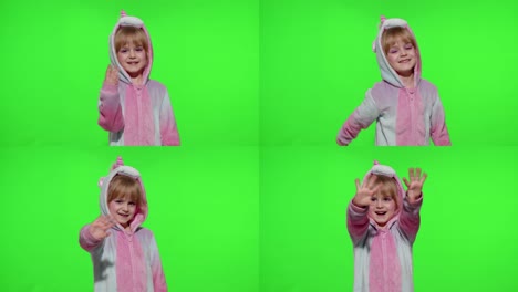 Little-child-girl-smiling,-waving-greeting,-hello-or-bye-with-hand-in-unicorn-pajamas-on-chroma-key