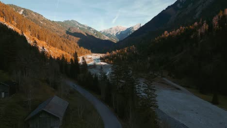 scenic and idyllic mountain valley river canyon with fresh blue water in the bavaria austria alps, flowing down a beautiful forest along trees near sylvenstein speicher and walchensee