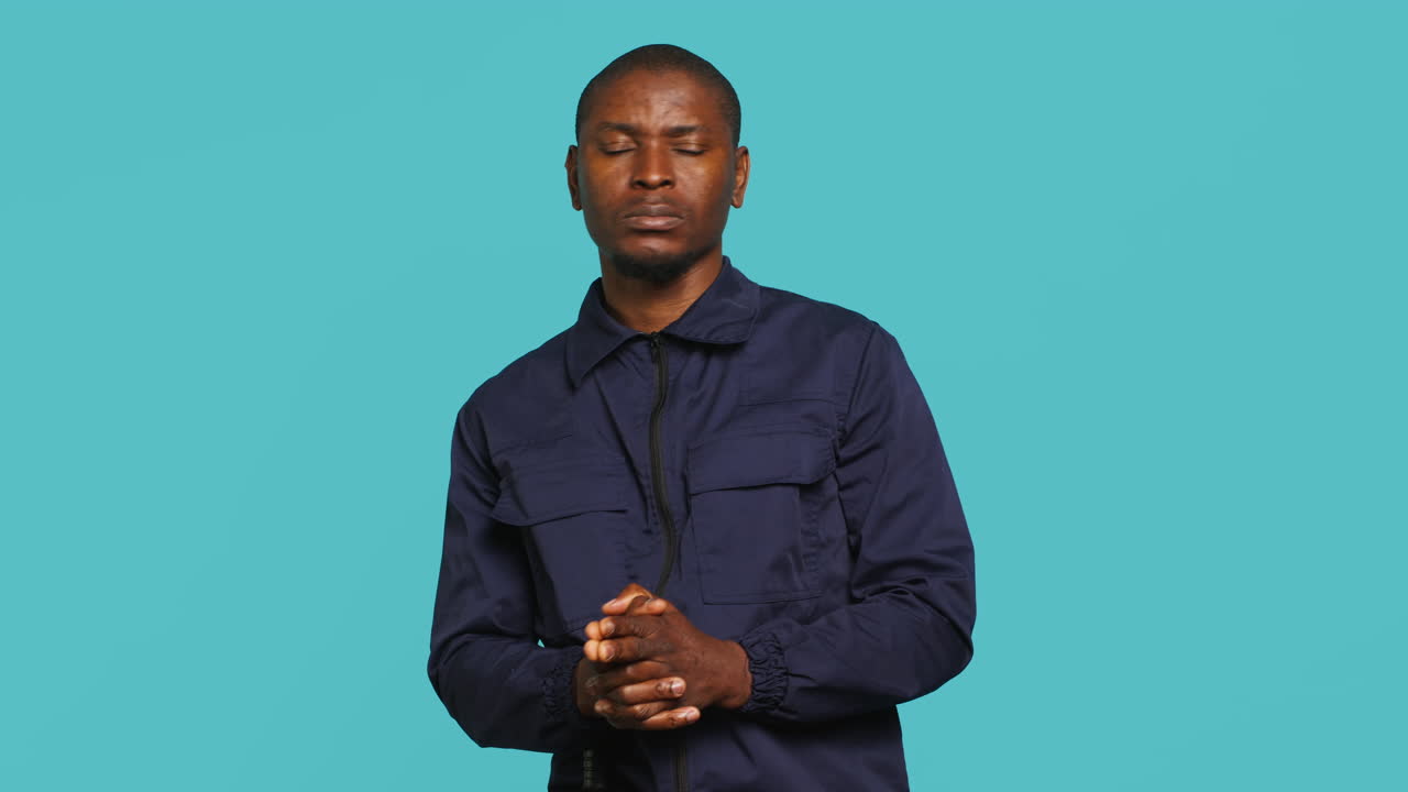 Private law enforcement worker doing pistol fingers hand gesture