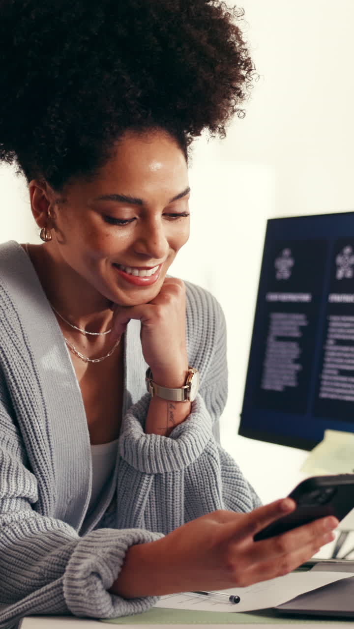 Young Woman Smiling and Using Smartphone Indoors