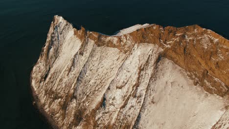 snowy cliff by the sea