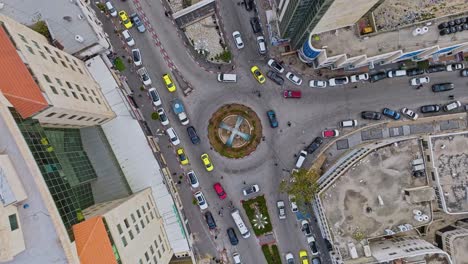 Above-View-Of-Roundabout-Road-And-Traffic-In-Hebron,-Southern-West-Bank,-Palestine