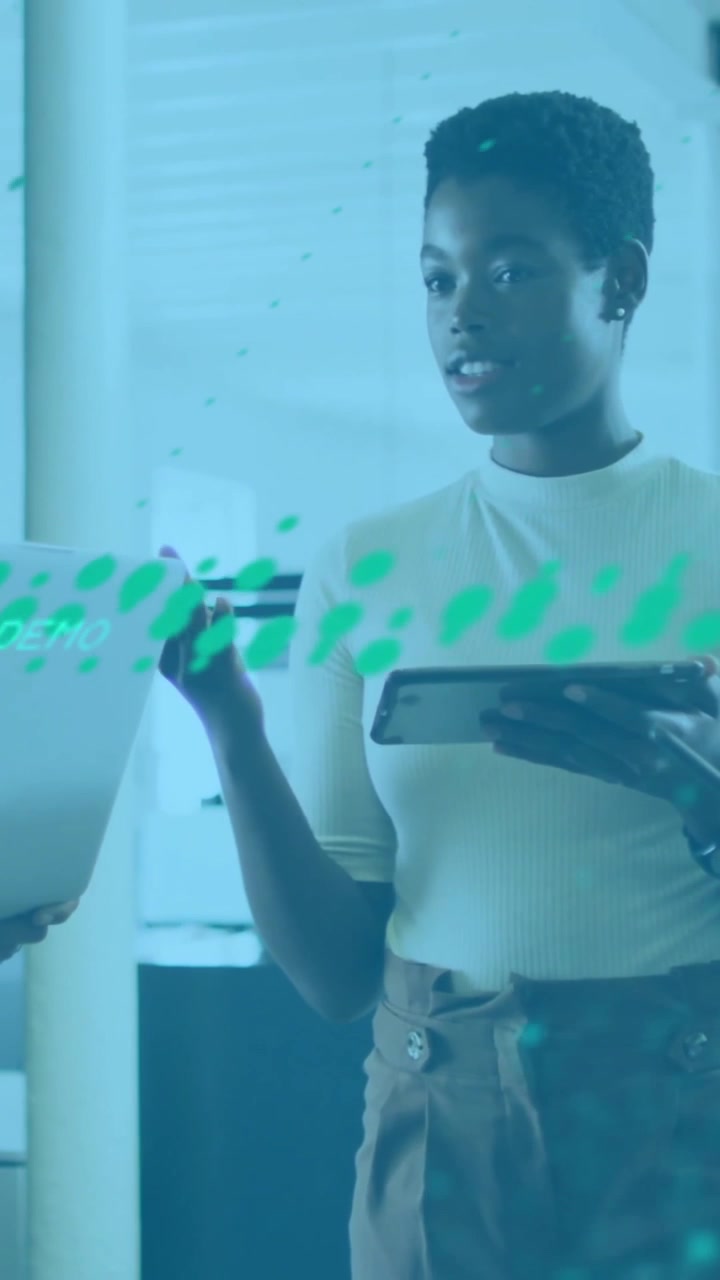 Animation of financial data processing over diverse colleagues discussing work in office