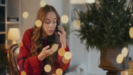 woman talking on mobile phone at home