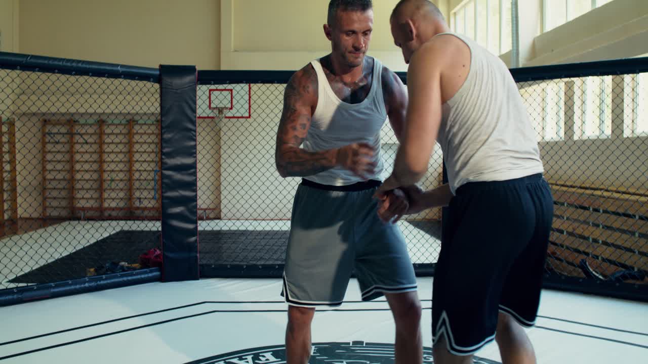 MMA Fighters Training in Cage