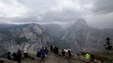 tilt-shift effect at glacier point overlook in yosemite, tourists taking photos