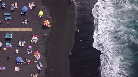 aerial top down black sand tropical beach in tenerife island top holiday tourist destination for holiday