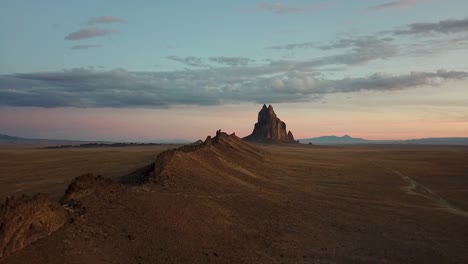 drone flight ascending revealing massive rock formation in new mexico