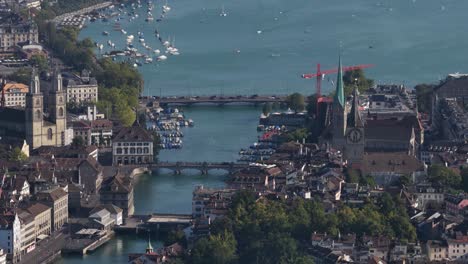 aerial drone video of zurich city views, zurich lake, cathedrals, skyline, and limmat river