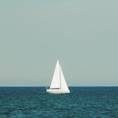 sea with a sailboat on the horizon. sea horizon.