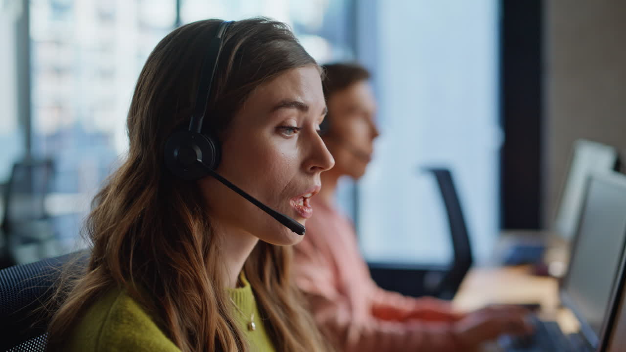 Closeup hand grabbing headset communication at workplace. Specialist assisting