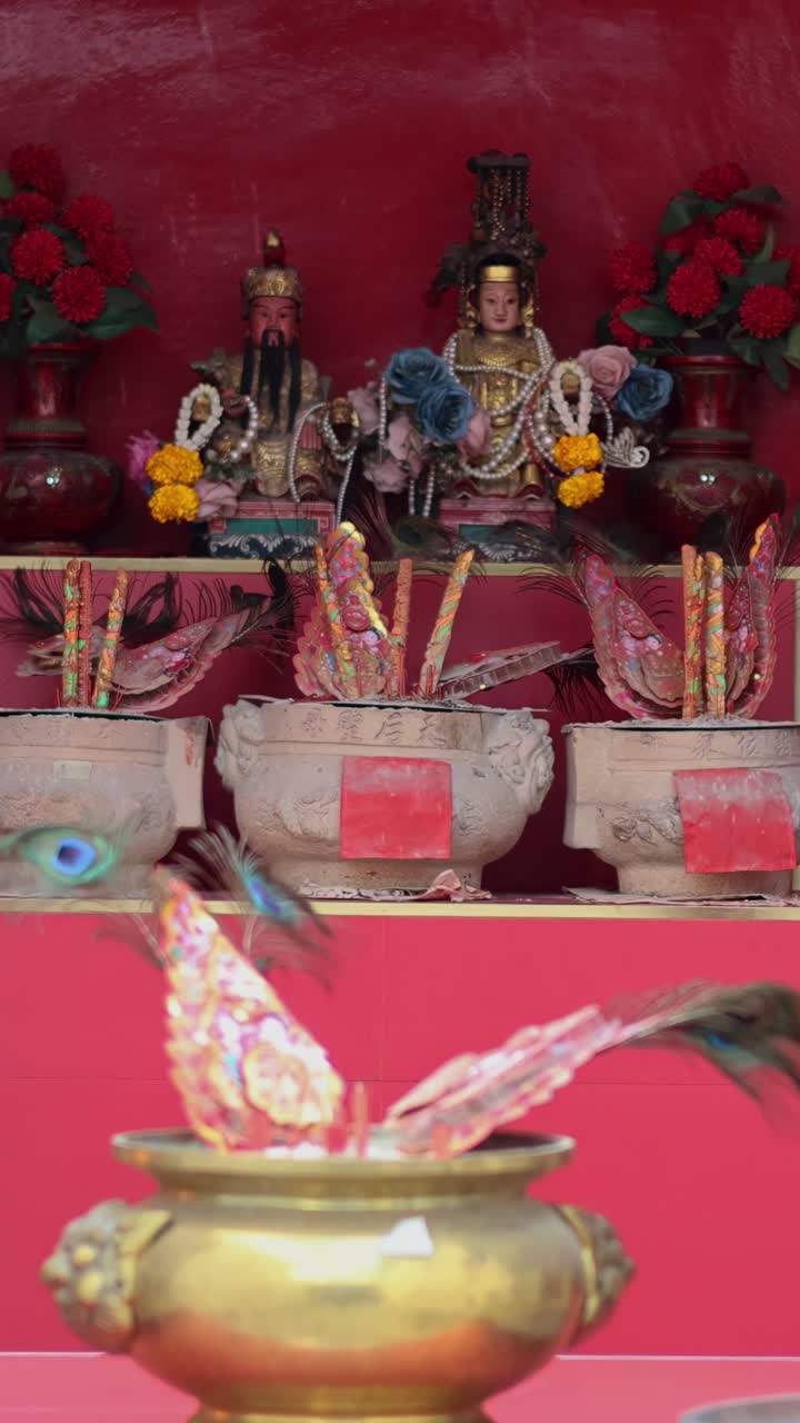 Incense sticks burning at a traditional Chinese shrine