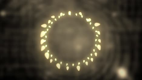 Glowing-circle-of-fairy-lights-on-grey-background