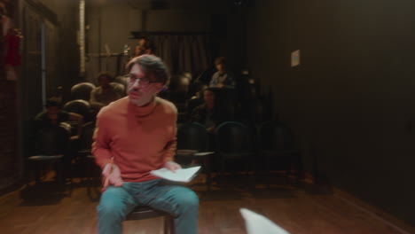 theater director talking to actresses during rehearsal