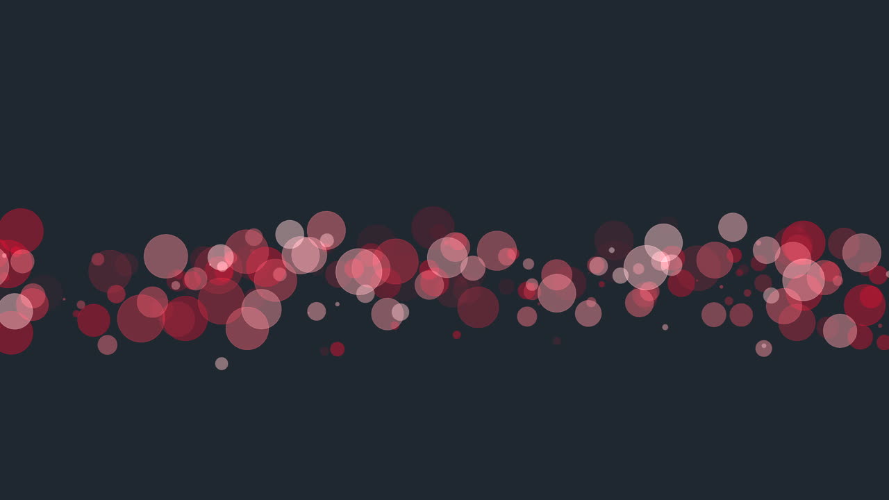 Bold red dots in linear formation against black background
