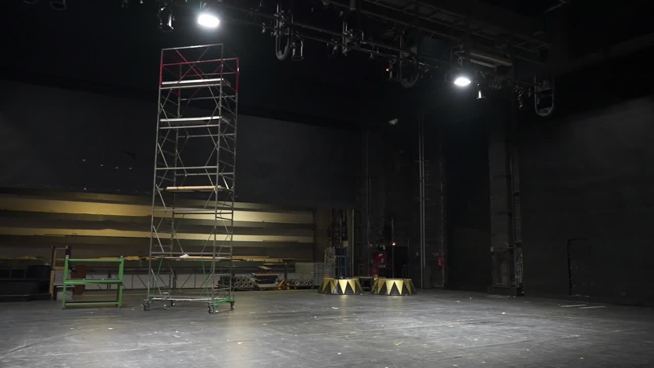 Theater backstage with scaffolding and equipment