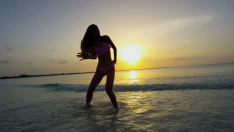 happy asian chinese female in bikini on beach