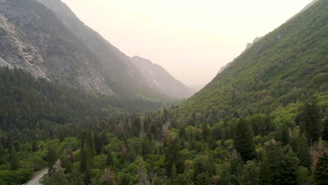 steep mountain valley scenery in breathtaking big cottonwood canyon, utah - aerial