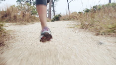 woman running trail close up shoes steadicam shot